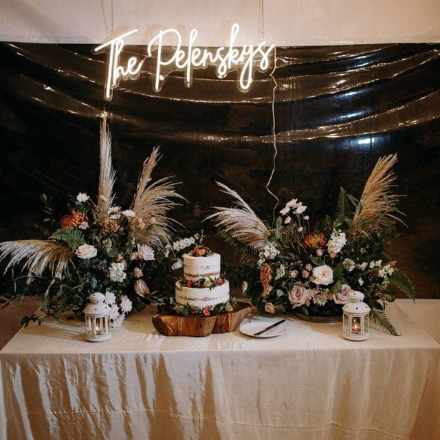 Party Custom Neon Sign Over Flowers And Desks