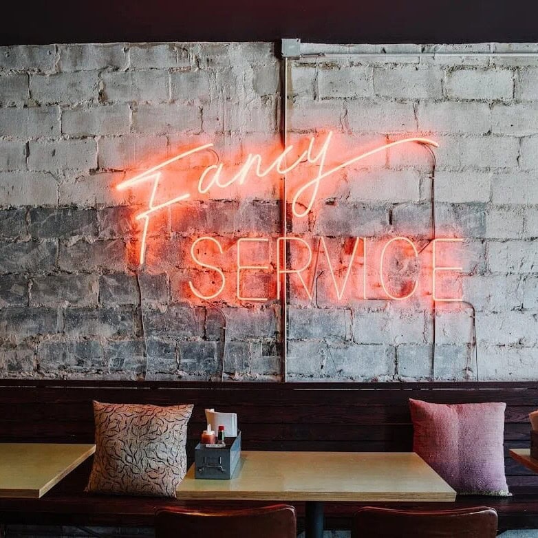 bon ton atlanta restaurant glass neon sign wall decor
