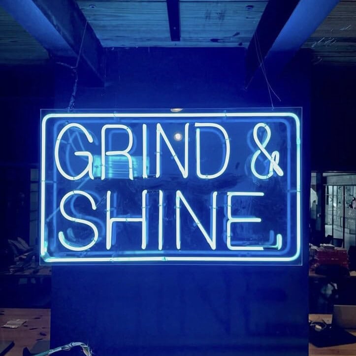 blue glass neon sign for coworking space