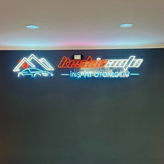 custom autoshop logo neon sign on black wall
