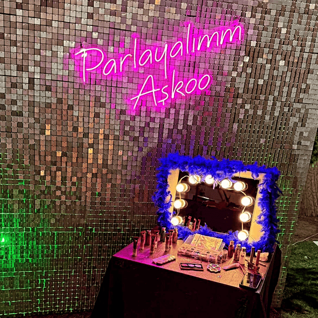 hot pink neon sign with shimmer wall for she shed space