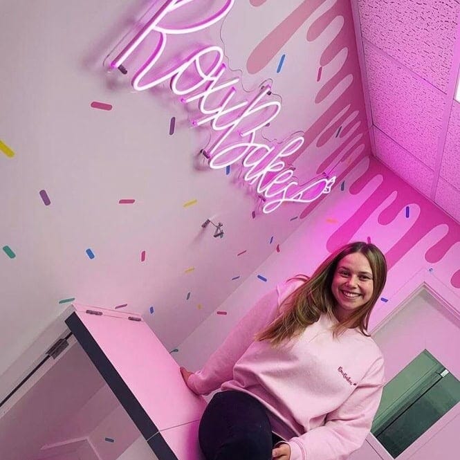 pink-custom-led-neon-sign-for-bakery-with-standoffs