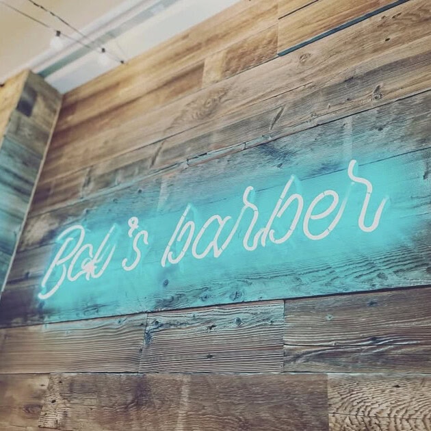 teal custom glass neon sign for barber shop
